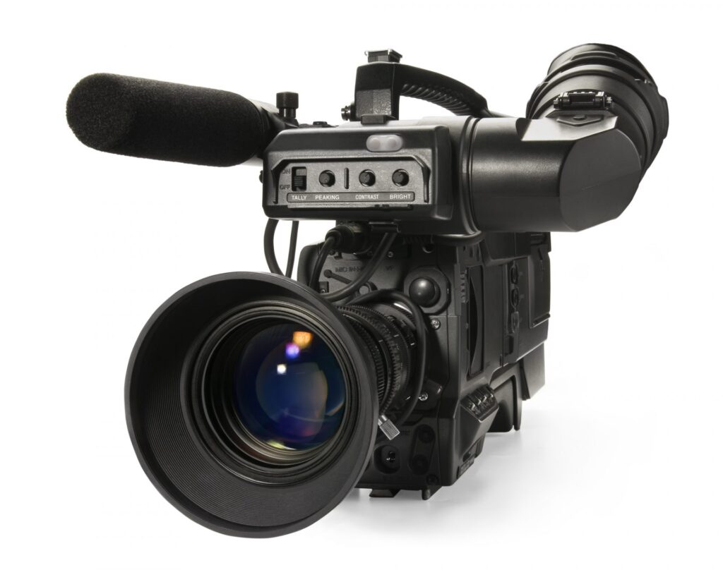 Professional digital video camera, isolated on white background