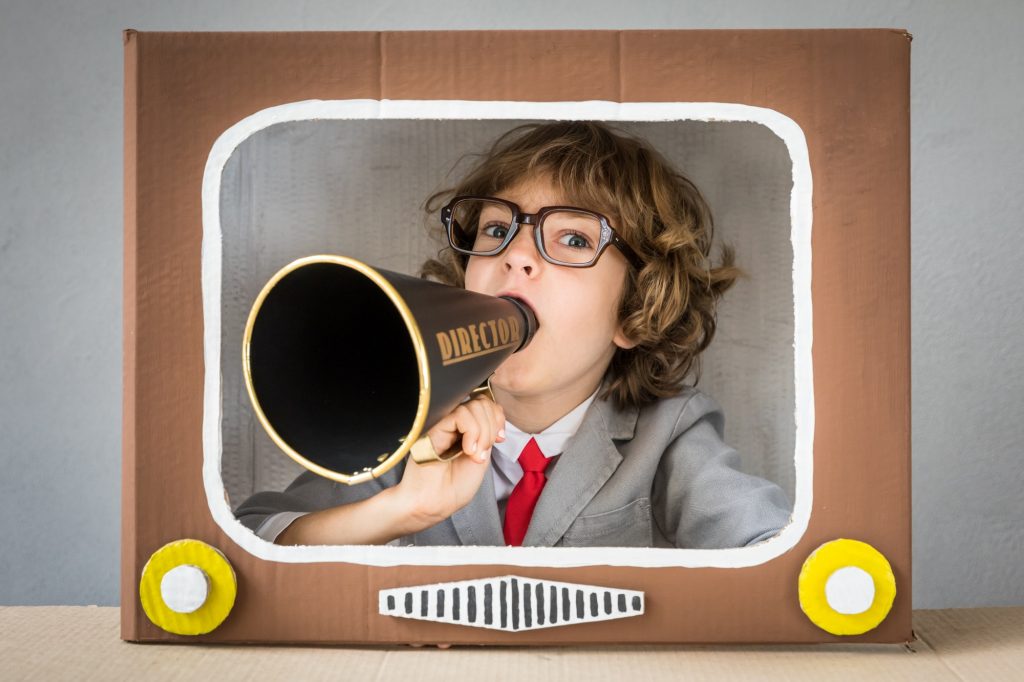 Child playing with cartoon TV