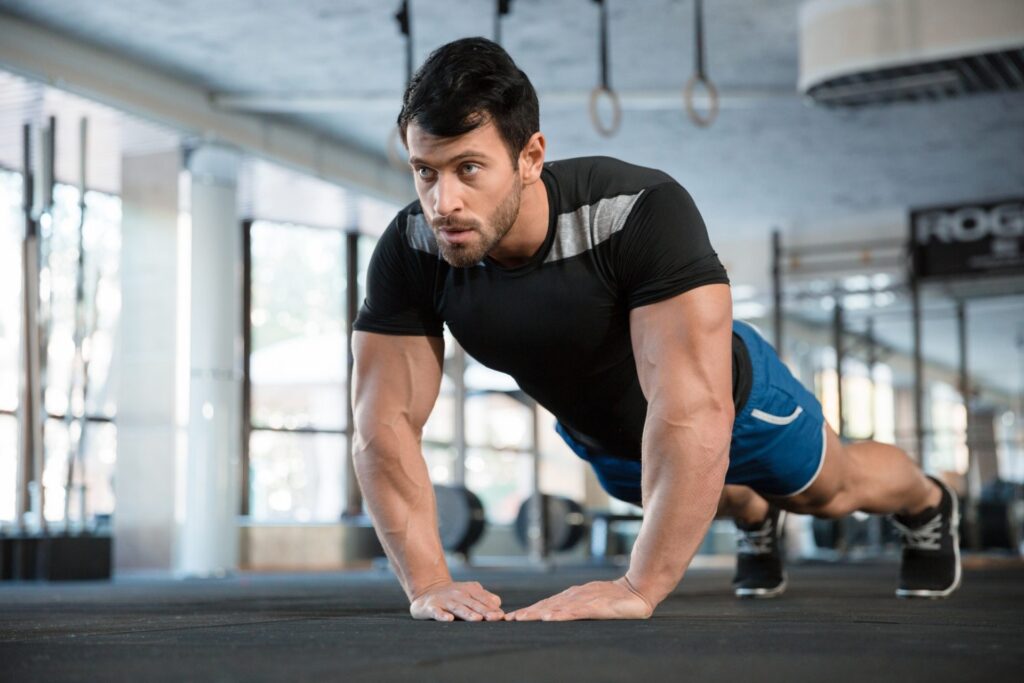 Sportsman doing exercise for arms