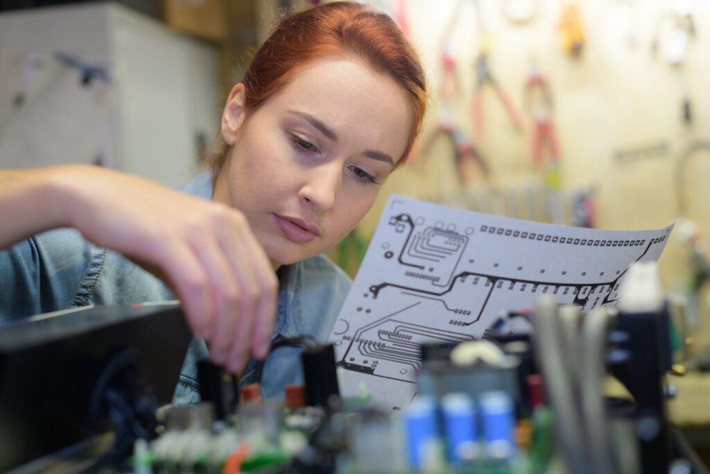 Woman following wiring instructions