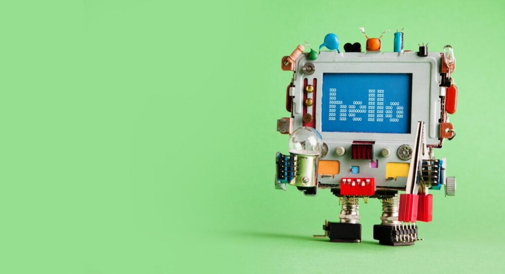 Robotic computer electrician with light bulb and red pliers in hands.