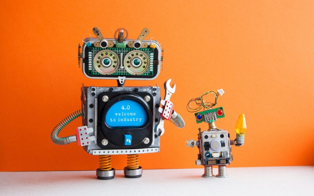 Industry 4.0 concept. Big IT specialist robot with hand wrench and small robotic character.