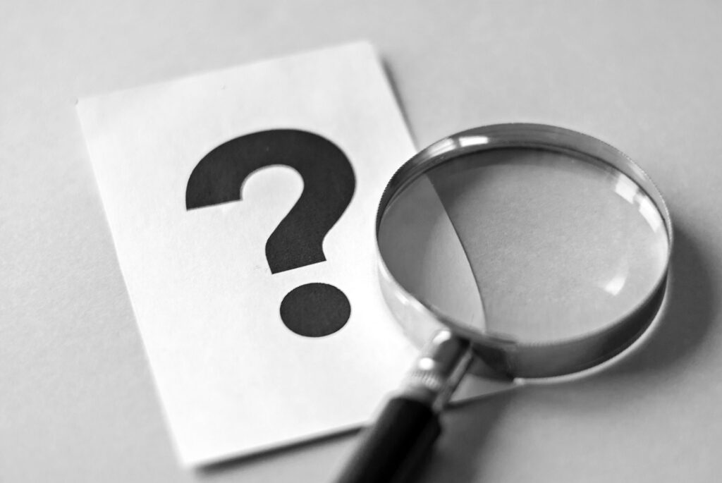 Magnifying glass and question mark search concept