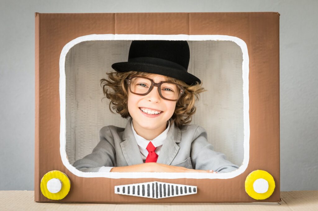 Child playing with cartoon TV