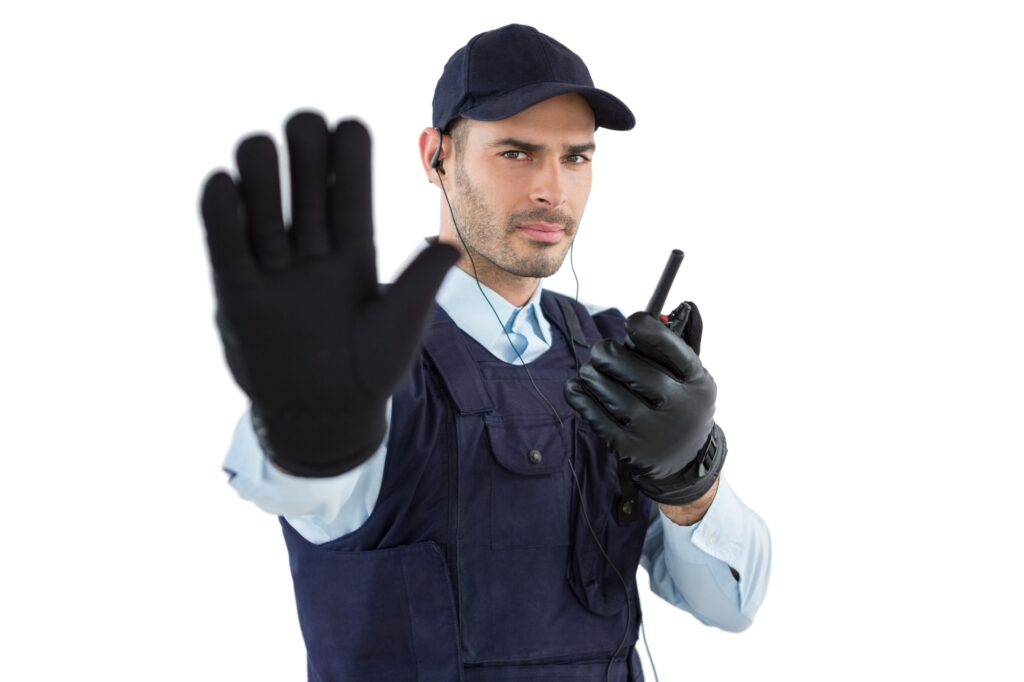 Zo voorkom je dat jouw online leeromgeving geld lekt! 4 Confident security officer making stop gesture