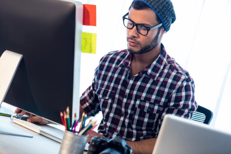 Photographer working at computer desk