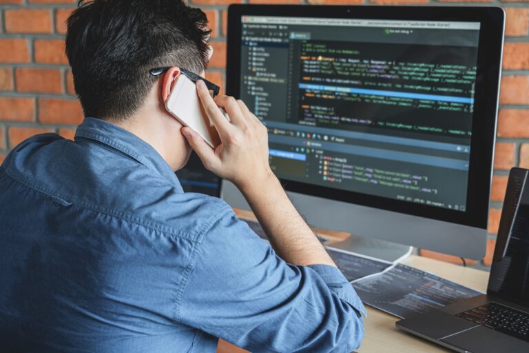 Young Professional programmer working at developing programming and website working in a software