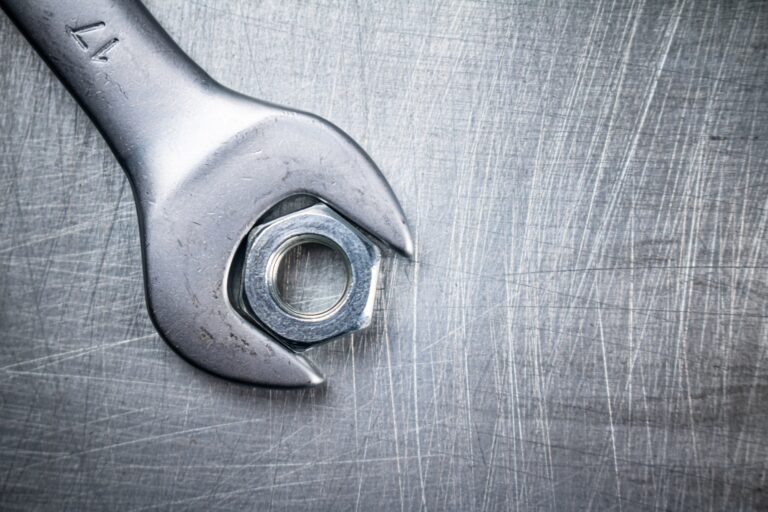 Metal wrench on the table.