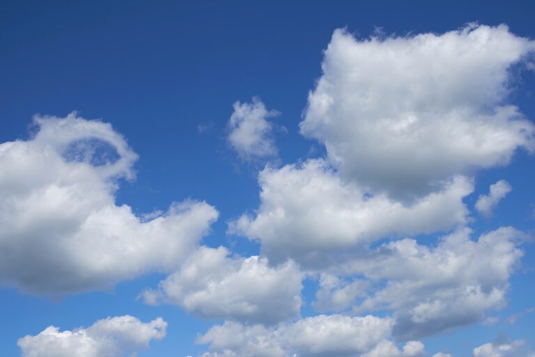 Cumulonimbus clouds. White cumulonimbus clouds floating in the blue sky.