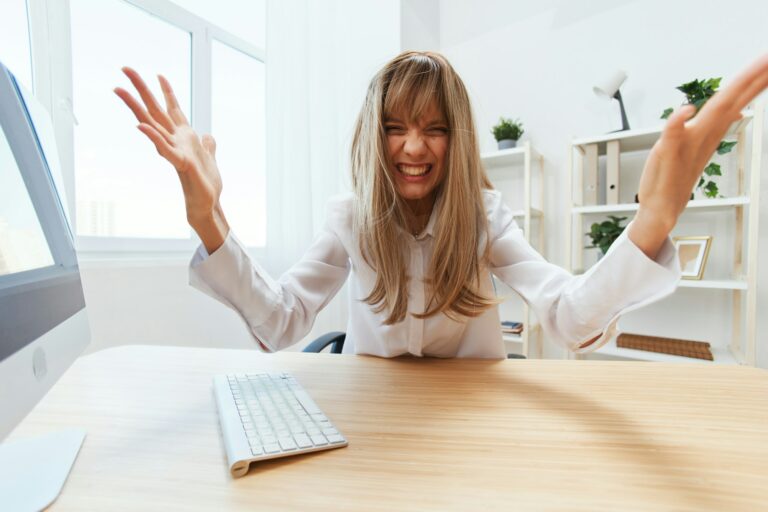 Evil irritated screaming adorable blonde businesswoman worker freelancer made critical mistake in