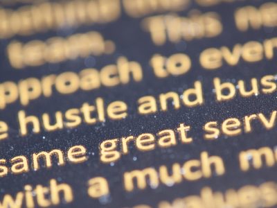 Selective focus photography of hustle and bust text