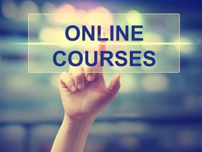 Hand pressing an online course button