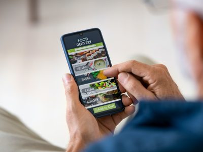 Man using mobile app to order delivery food