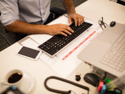 mid-section-of-businessman-working-in-office