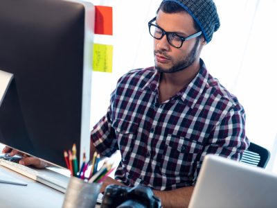 Photographer working at computer desk