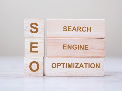 seo-search-engine-optimization-text-wooden-cube-blocks-on-table-background