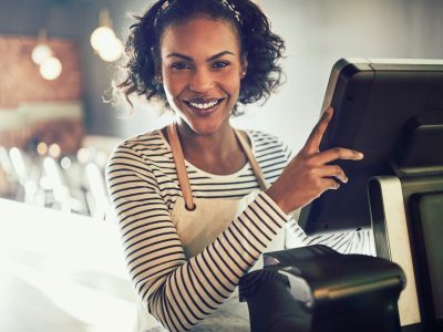 smiling-young-african-waitress-working-in-a-trendy-restaurant-1