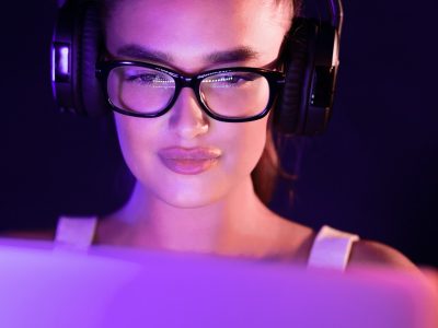 student-watching-online-tutorials-wearing-headphones-in-the-night