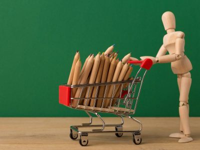 wooden-mannequin-with-miniature-shopping-cart